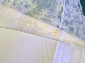 The addition of an elastic suport across the back holds the dress securely in place.